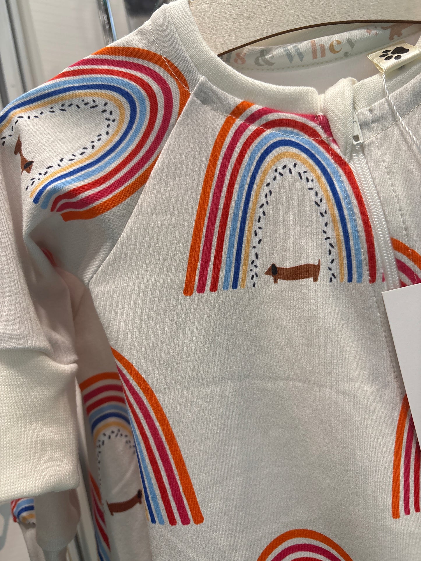 Sausage dog and rainbows zippy baby-grow