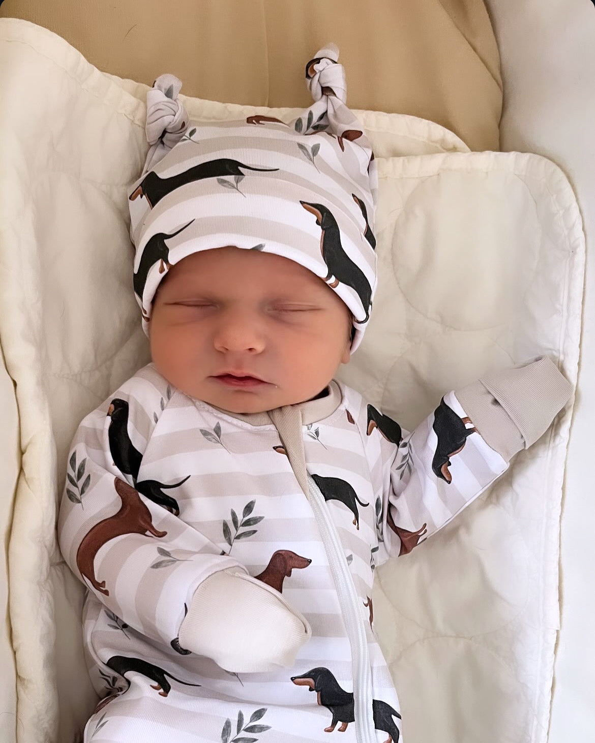 Neutral stripe sausage dog zippy baby-grow