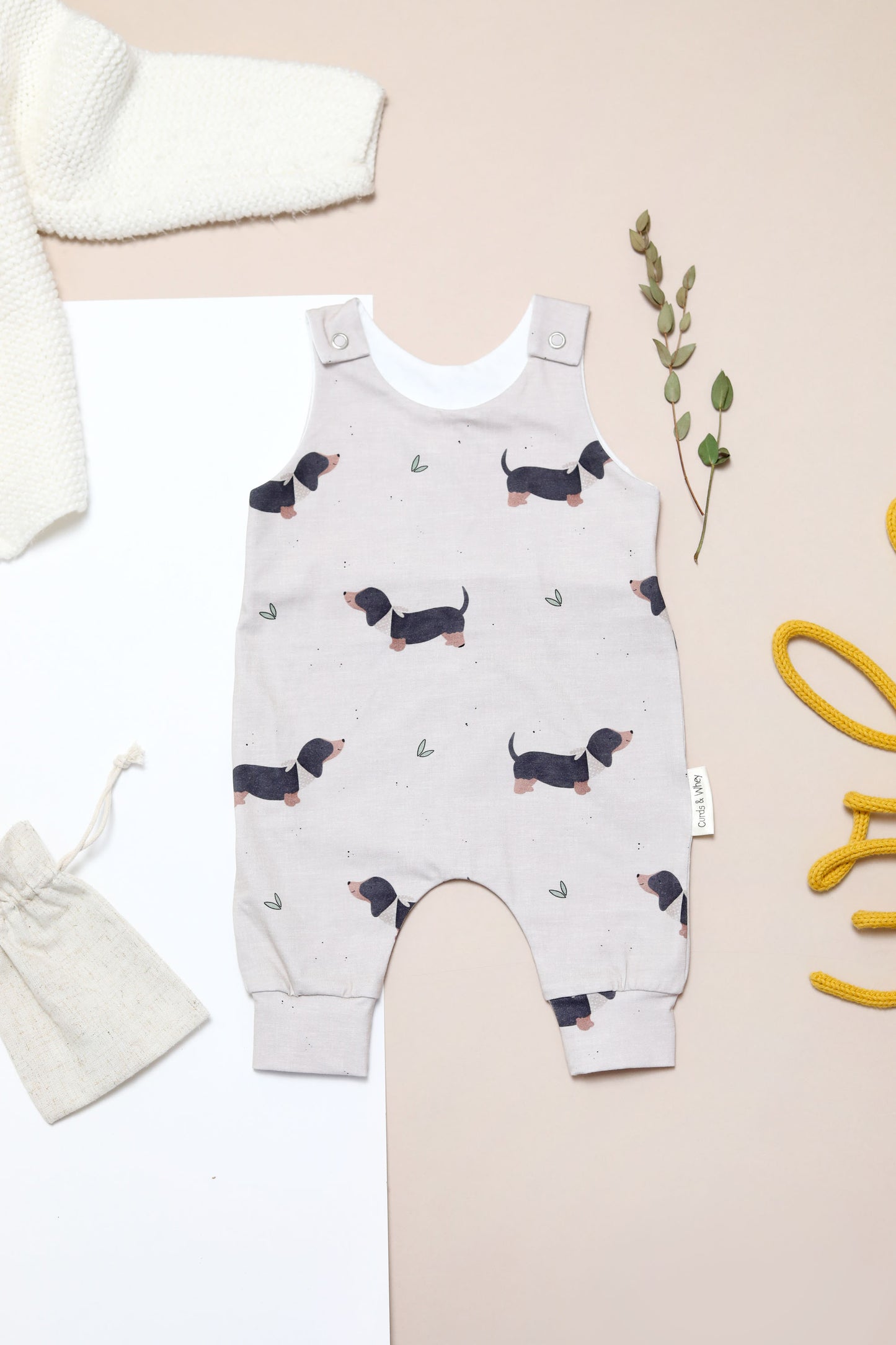 Erik Black and Tan sausage dog oatmeal romper