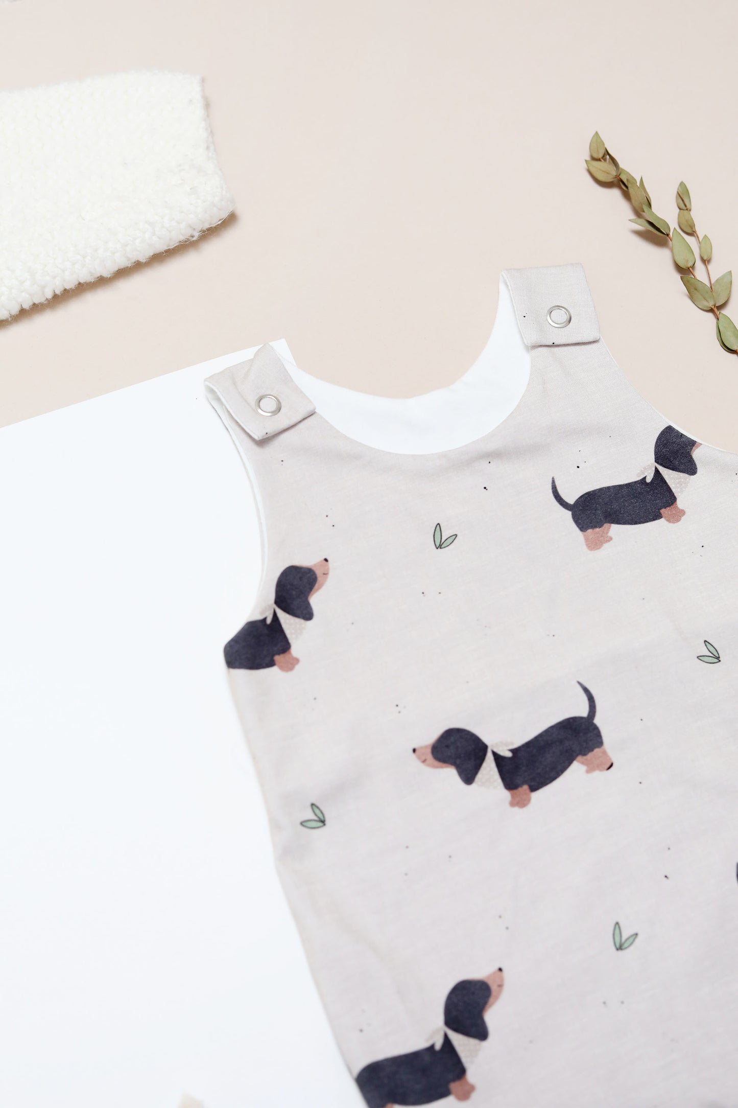 Erik Black and Tan sausage dog oatmeal romper