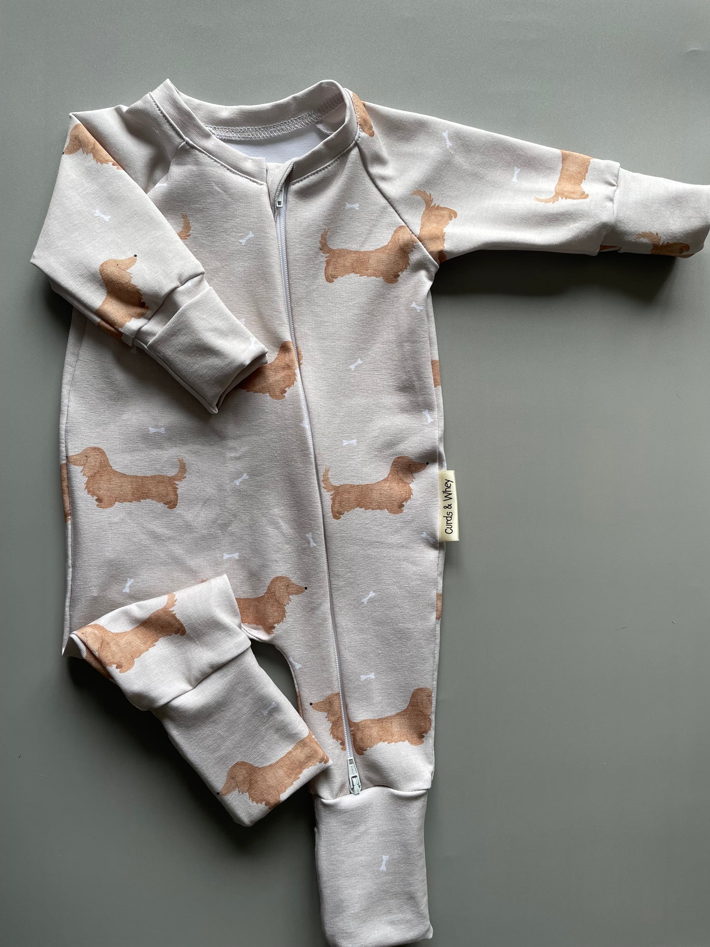 Winnie cream long haired zippy baby-grow