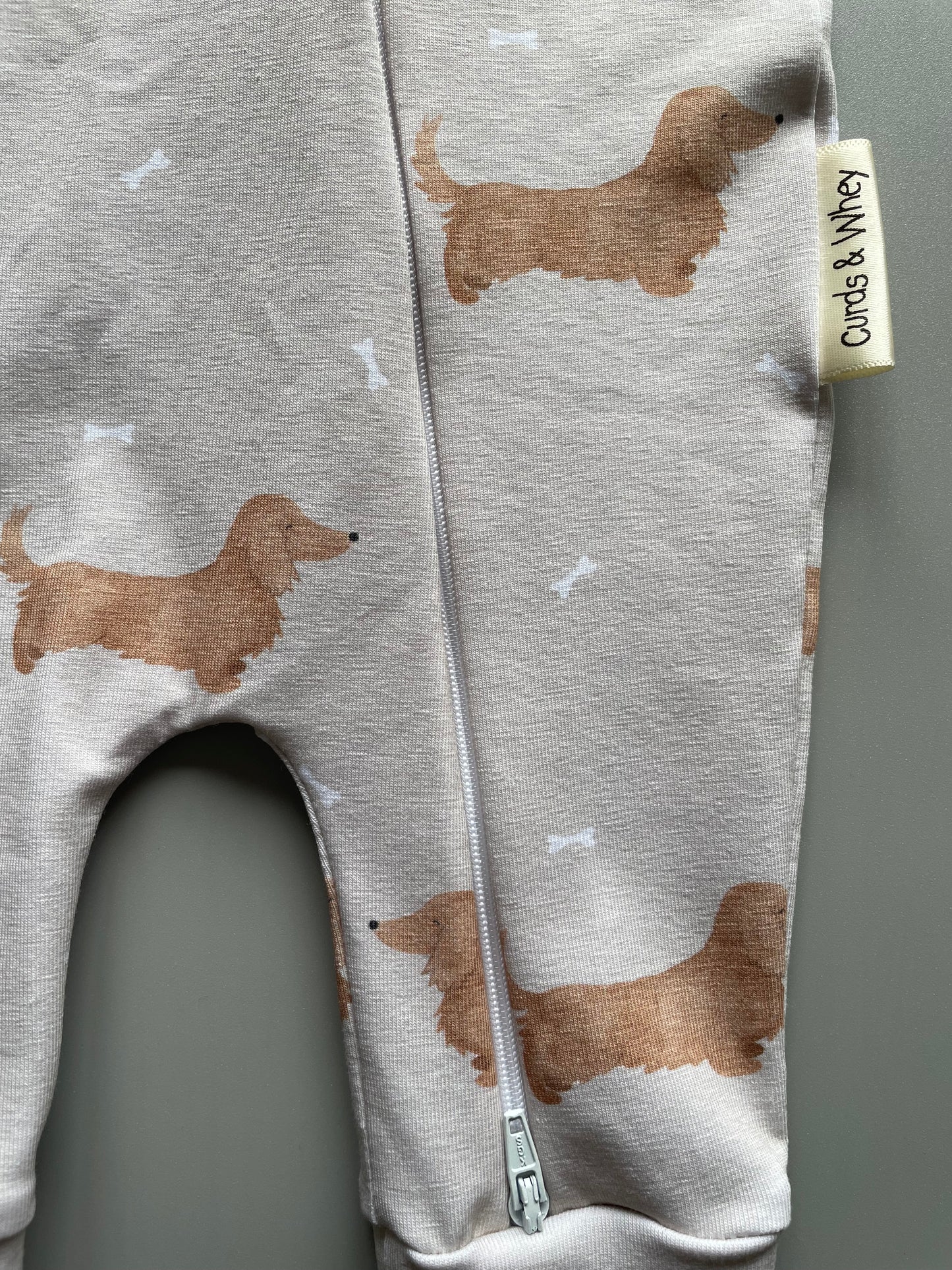 Winnie cream long haired zippy baby-grow