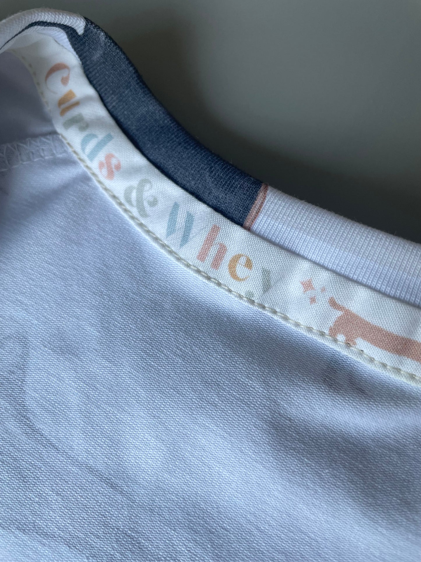 Neutral stripe sausage dog zippy baby-grow