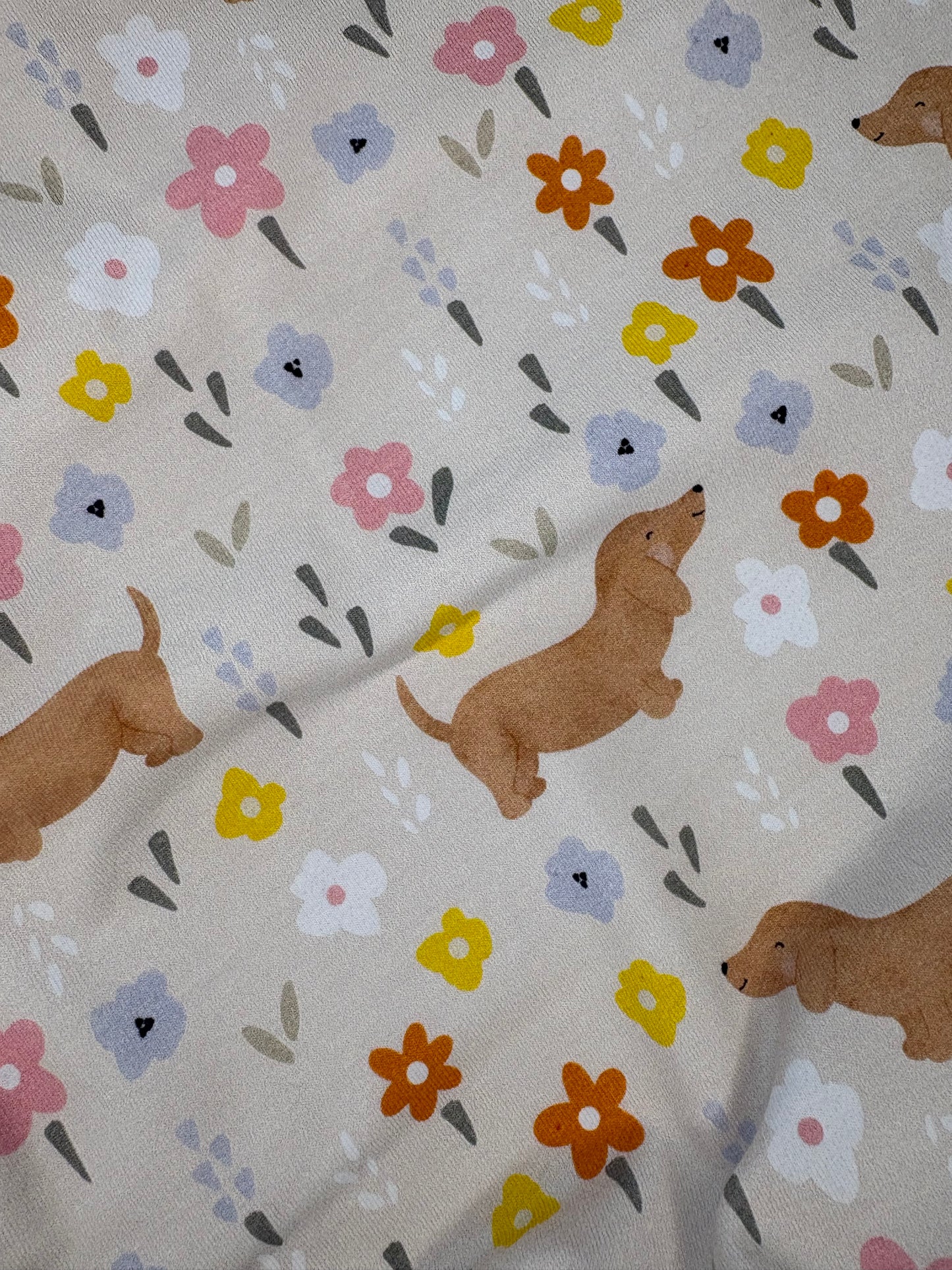 Flora sausage dog baby romper