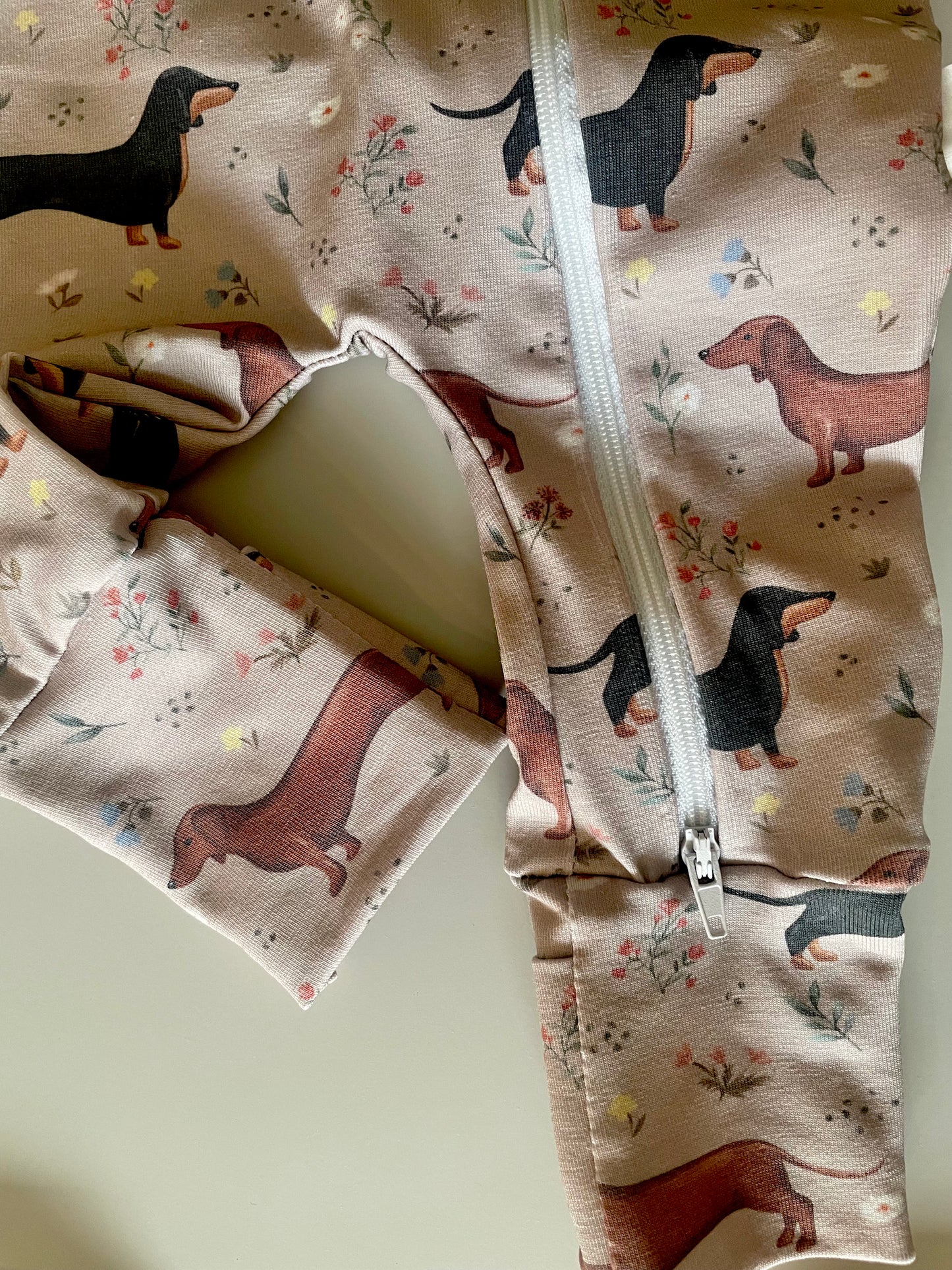 Florence sausage dog zippy baby-grow