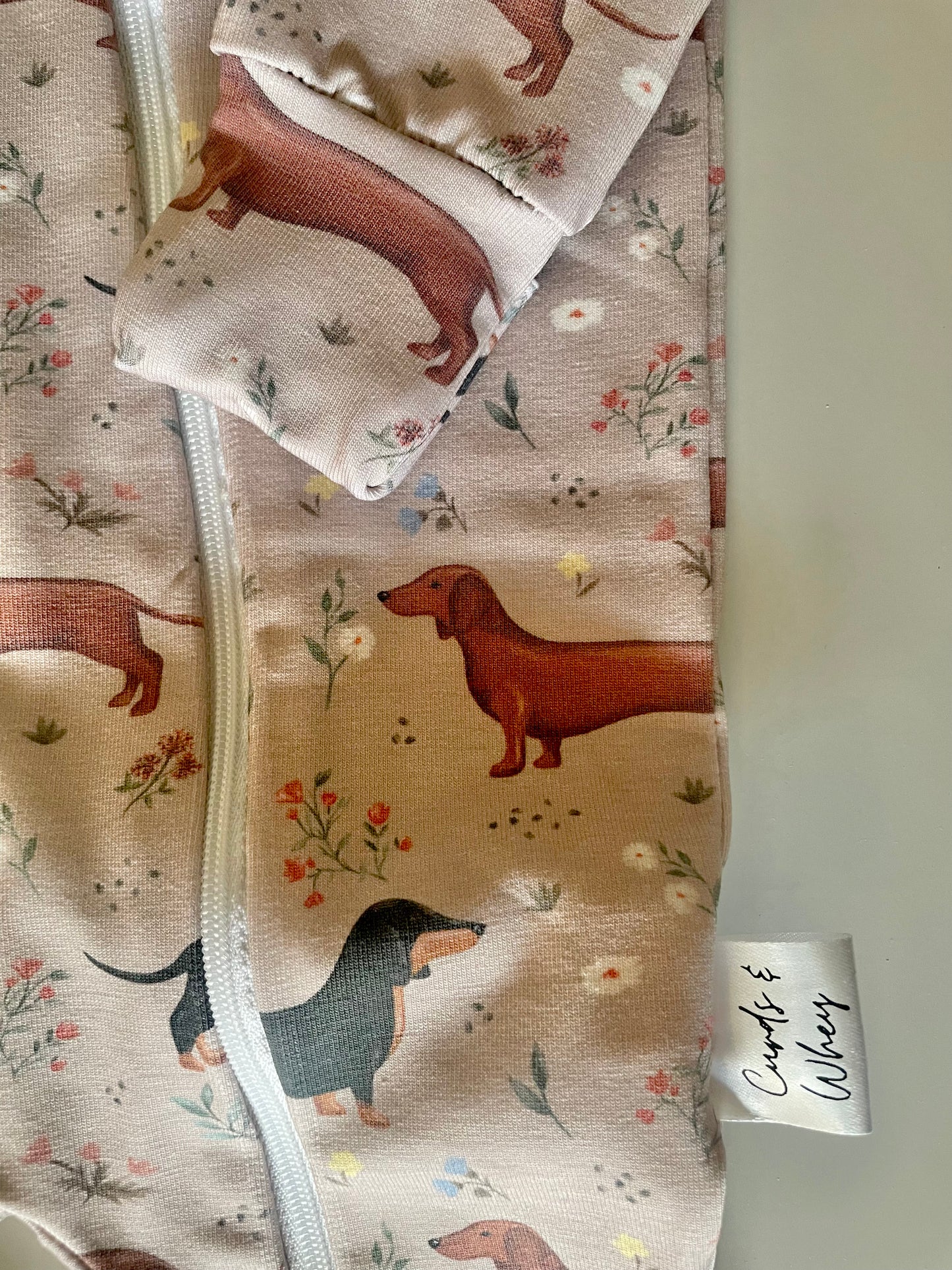 Florence sausage dog zippy baby-grow