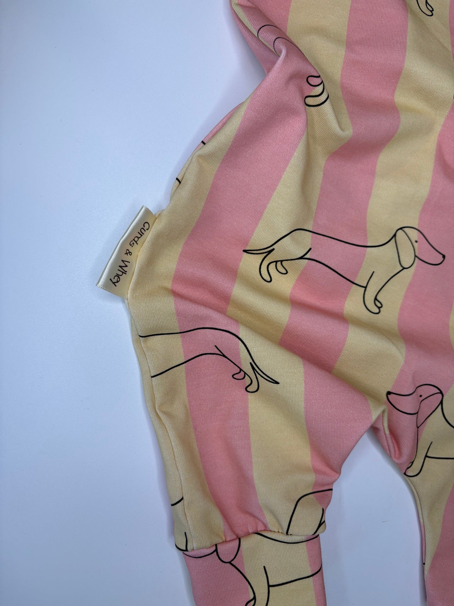 Rhubarb and custard sausage dog baby romper