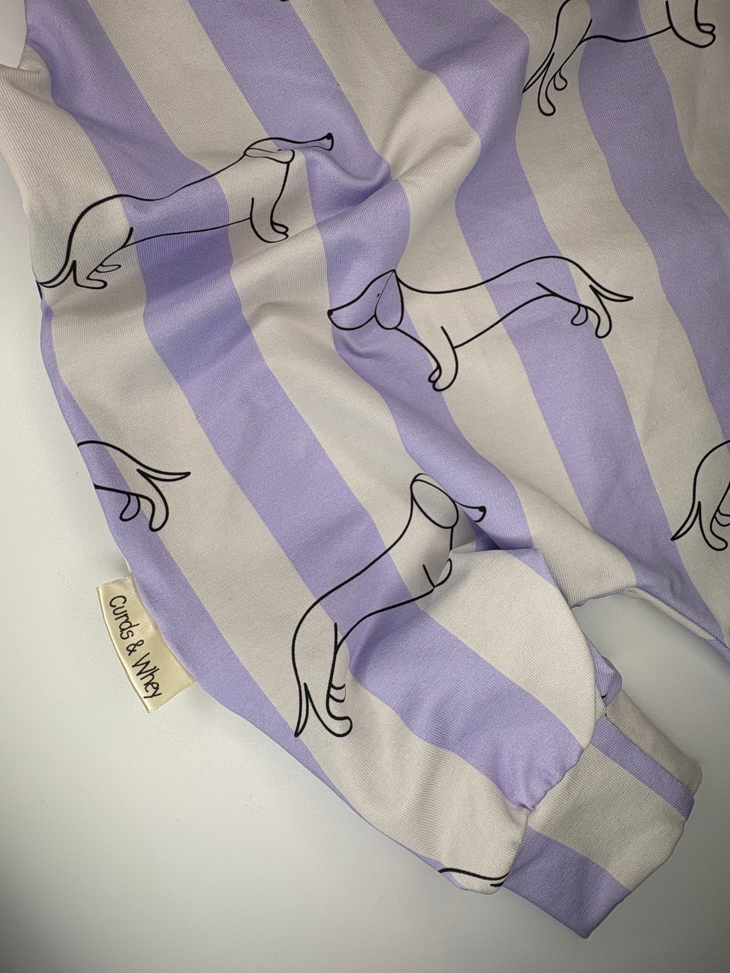 Parma violet sausage dog baby romper