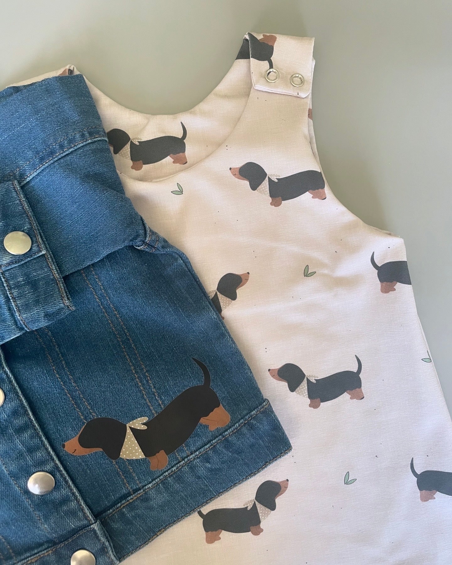 Eric Black and Tan sausage dog oatmeal romper