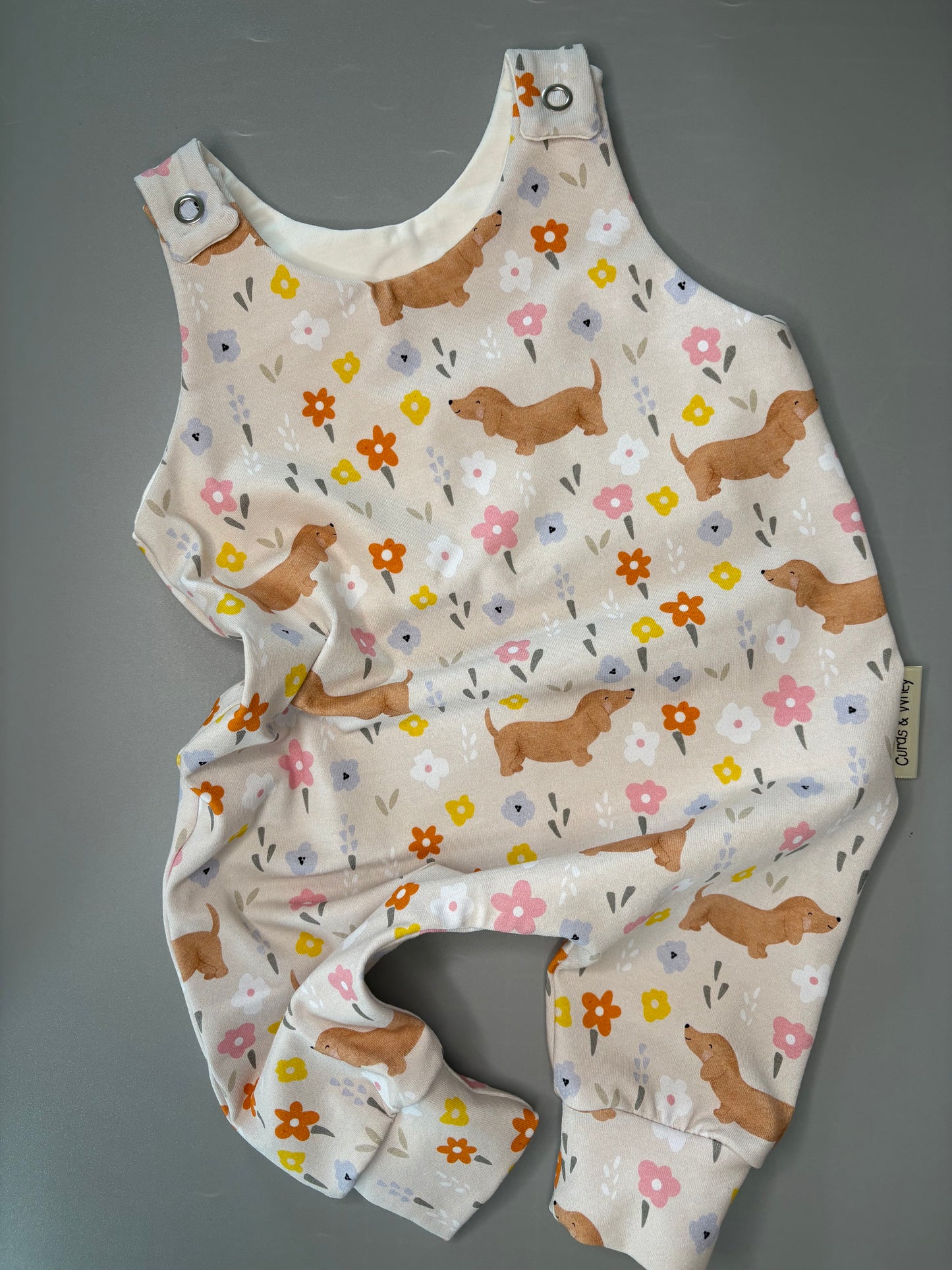 Flora sausage dog baby romper