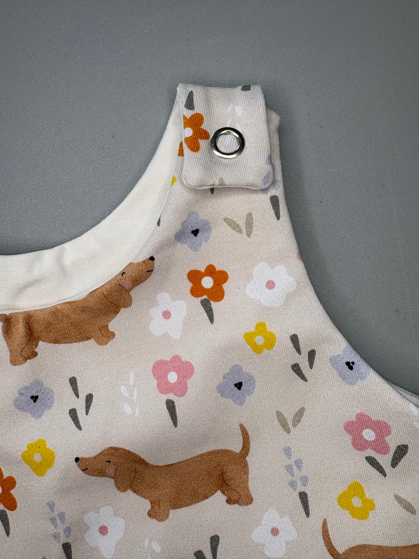 Flora sausage dog baby romper