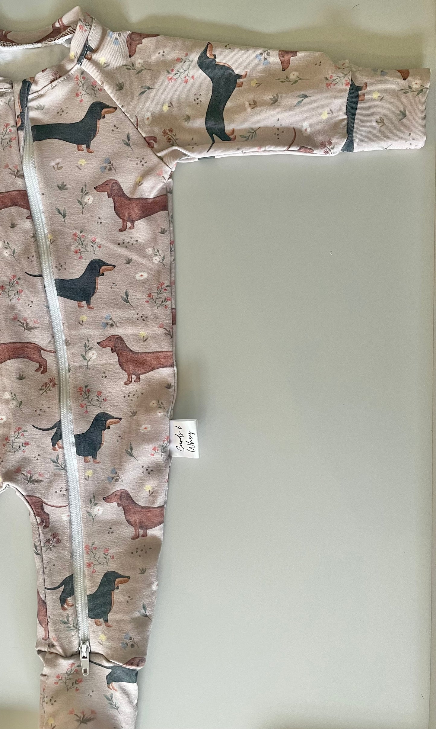 Florence sausage dog zippy sleepsuit