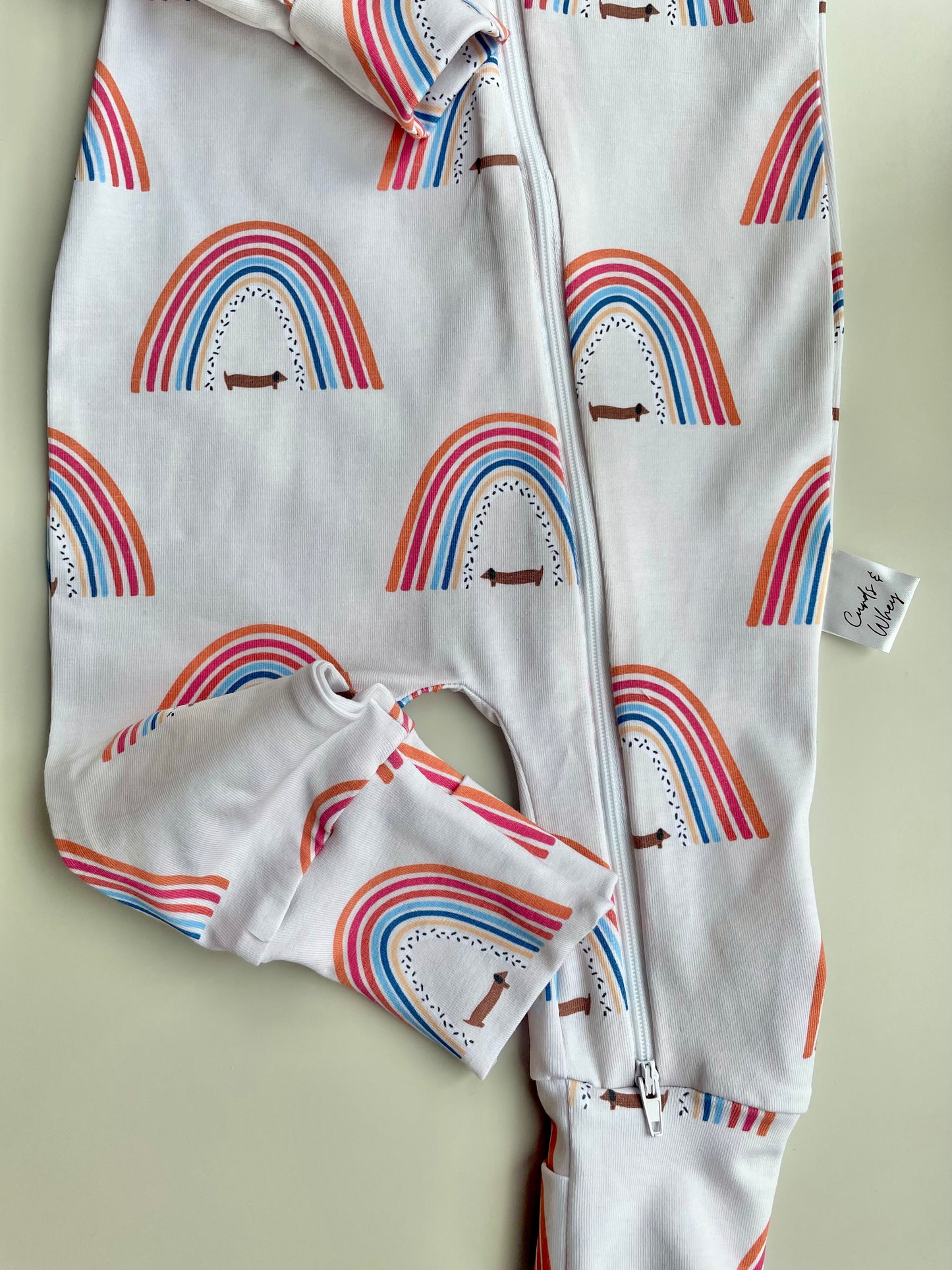 Sausage dog and rainbows  zippy sleepsuit